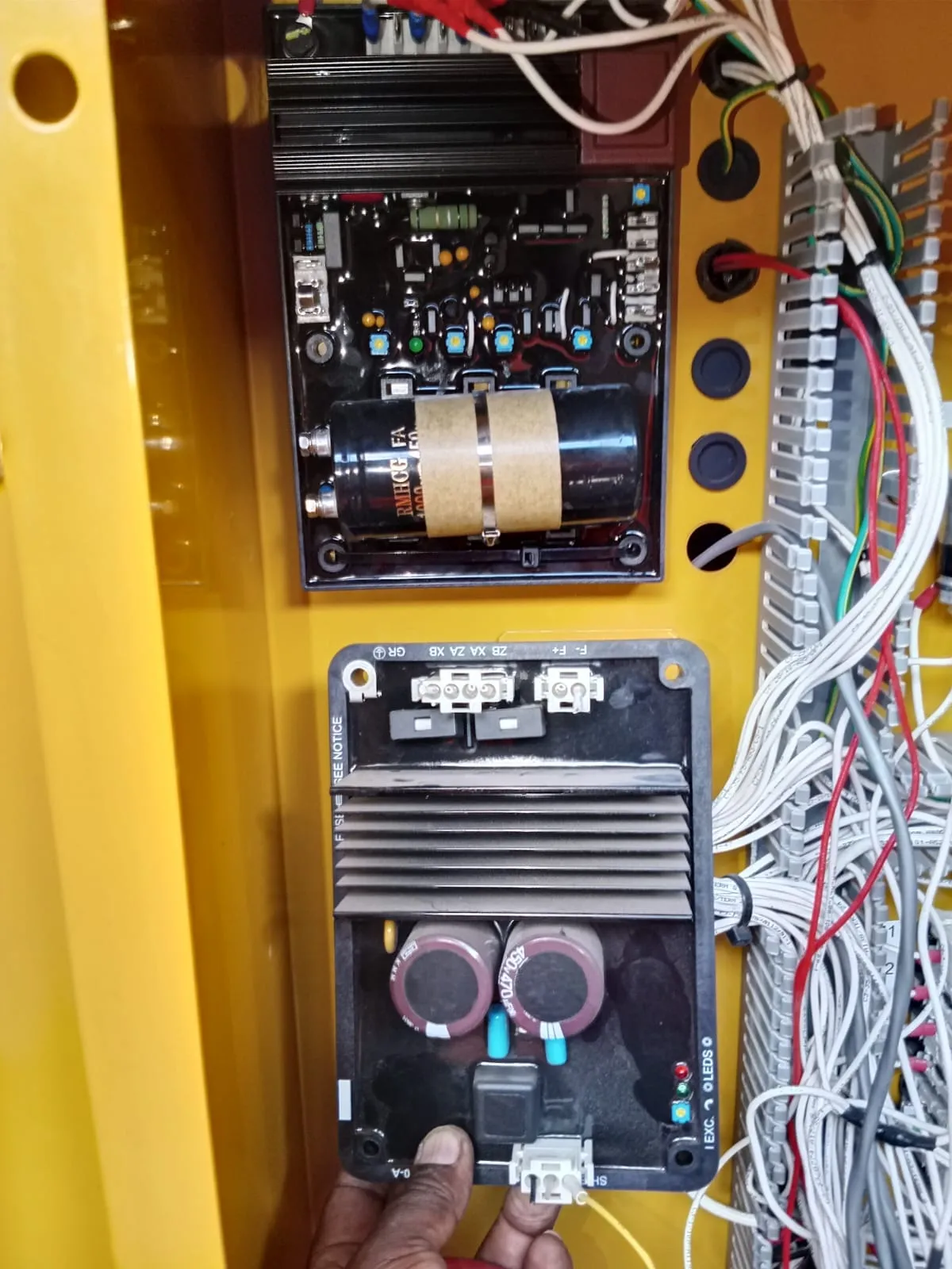 Automatic voltage regulator and excitation module inside a generator terminal box