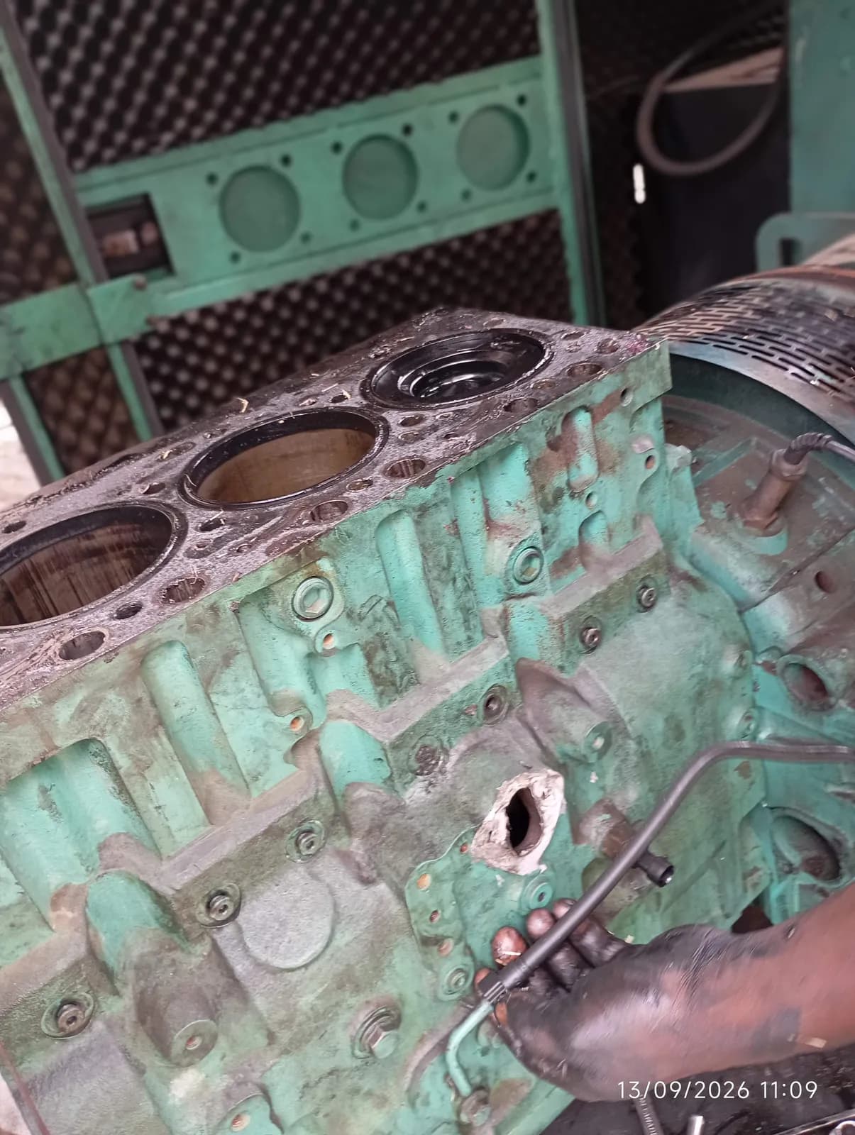 Generator engine block with the head off and the cylinder liners exposed