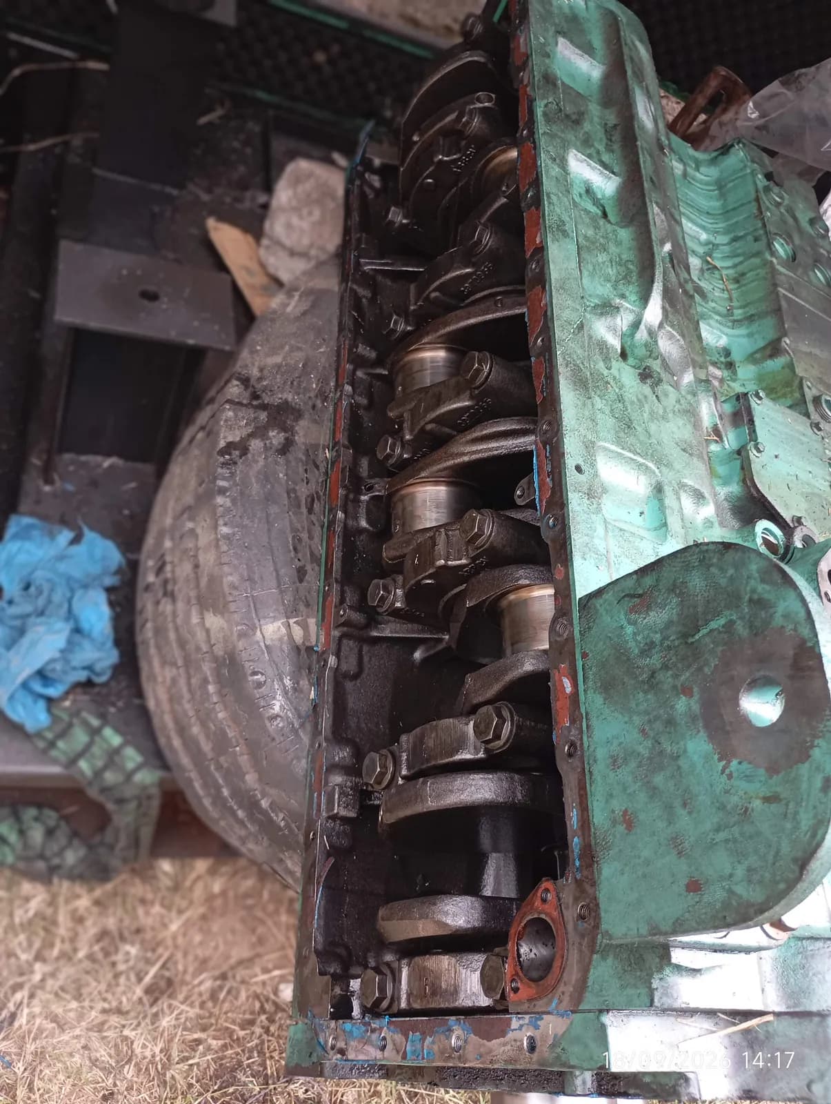 Underside of an engine block showing the crankshaft and main bearing caps