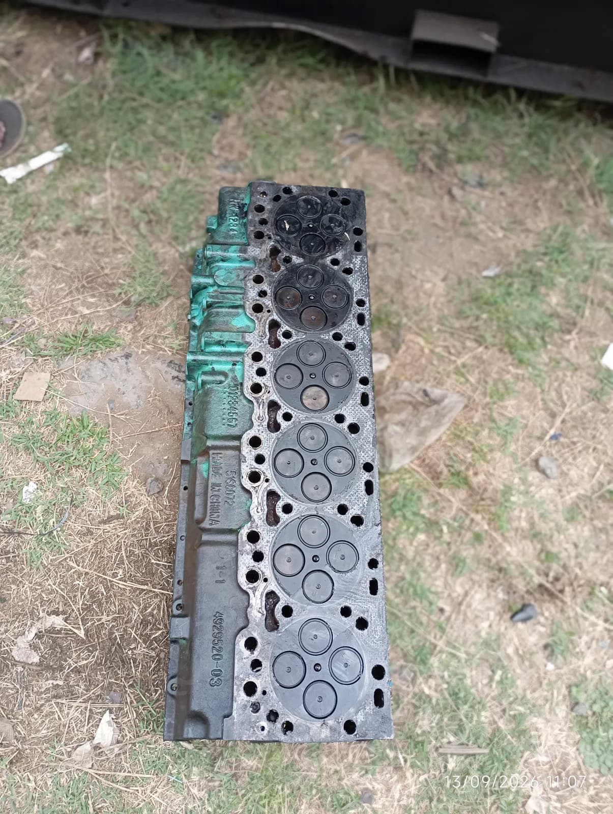 Six-cylinder cylinder head removed from a generator engine for overhaul