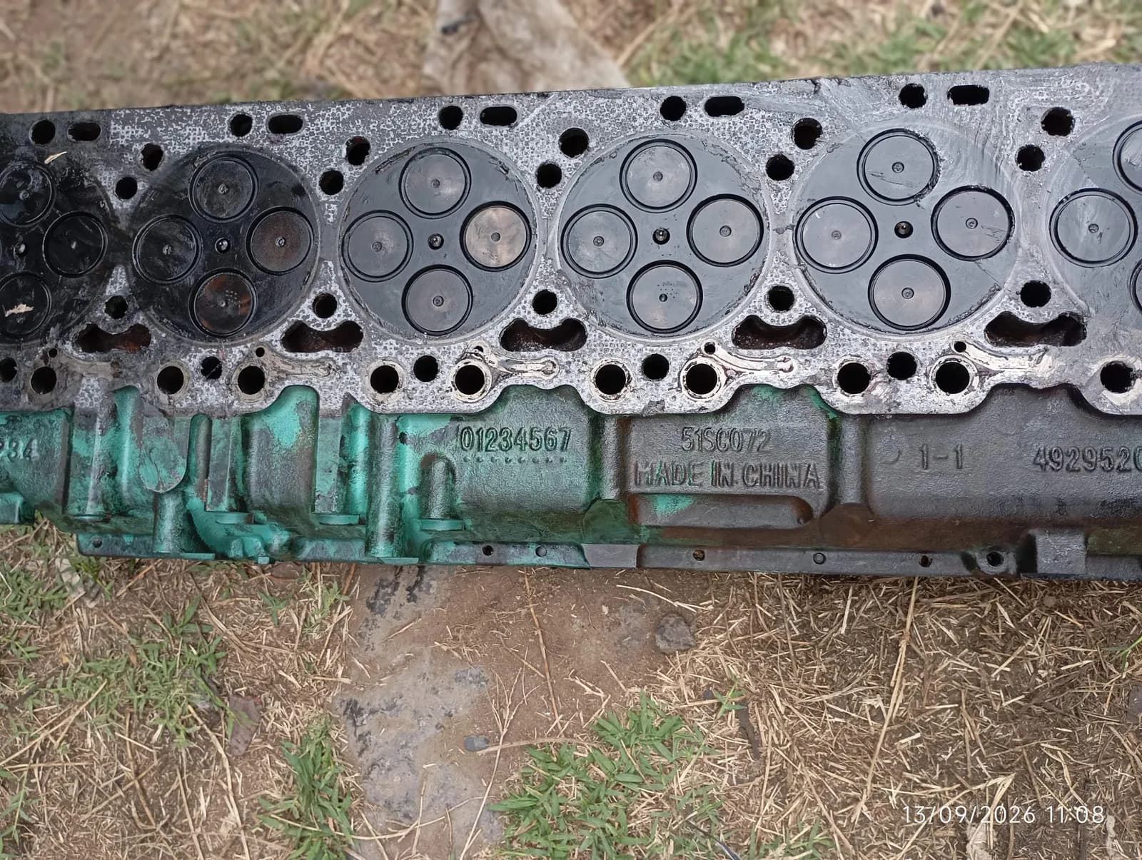 Close-up of the valves and combustion faces on a removed cylinder head