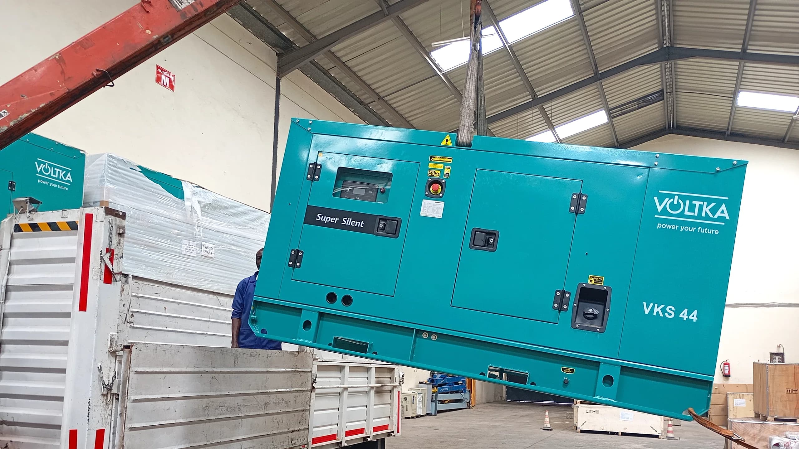 VOLTKA generator being offloaded by a crane truck