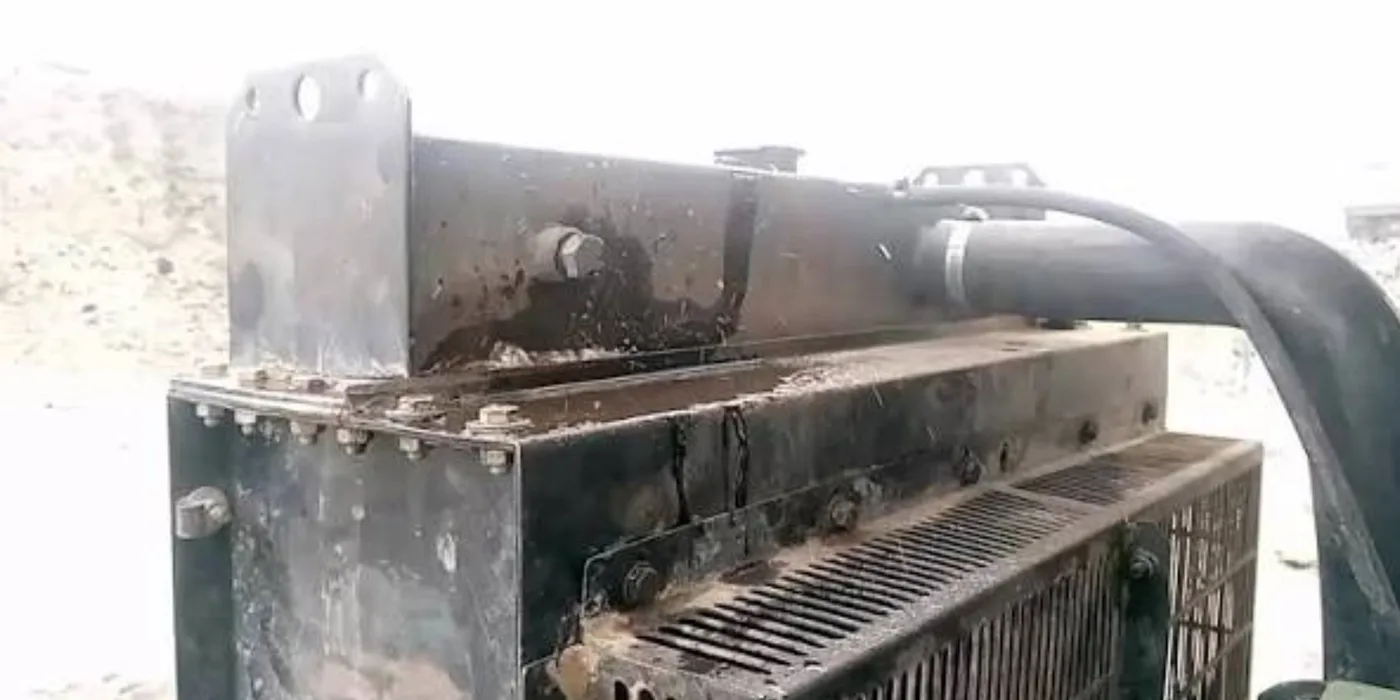 Top header tank and fabricated side plates of a large industrial generator radiator during workshop inspection and cleaning